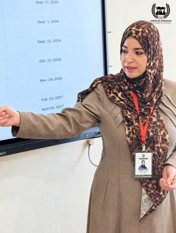 A teacher presents the key dates of the school year on screen