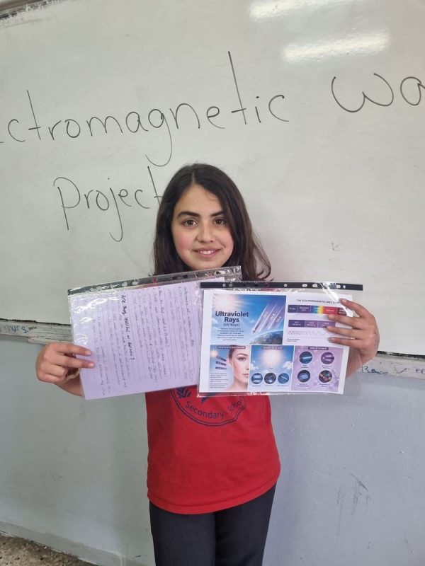 A student presents her electromagnetic waves science project
